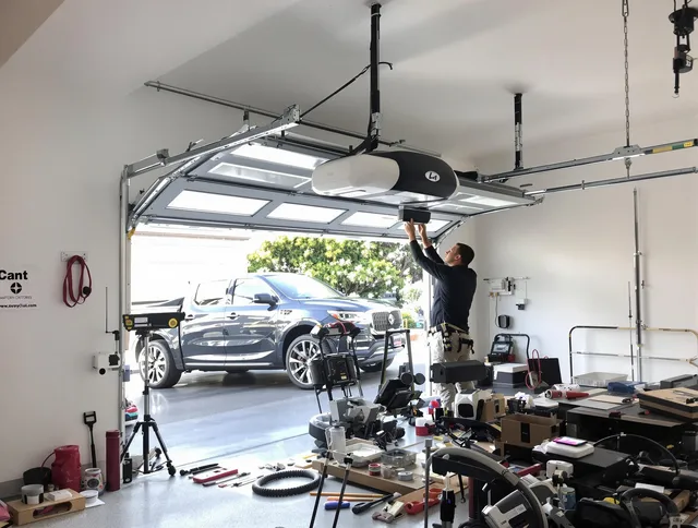 Beverly Hills Garage Door Repair specialist installing smart garage door opener system in Beverly Hills home